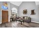 Bright living room with high ceilings, large windows, modern decor, and wood-look floors at 9225 E Pine Valley Rd, Scottsdale, AZ 85260