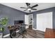 Spacious office with wood-look floors, ceiling fan, and closet is ideal for working from home at 9225 E Pine Valley Rd, Scottsdale, AZ 85260
