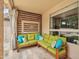 A cozy outdoor patio features comfortable seating with accent pillows, perfect for lounging and relaxation at 9225 E Pine Valley Rd, Scottsdale, AZ 85260