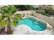 Inviting pool with waterfall and lush landscaping, perfect for relaxation and outdoor enjoyment at 9225 E Pine Valley Rd, Scottsdale, AZ 85260