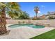 Inviting backyard featuring a refreshing pool with waterfall feature and desert landscaping at 9225 E Pine Valley Rd, Scottsdale, AZ 85260