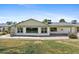 A long one story home with a large back yard and big windows overlooking the yard at 11627 S Jokake St, Phoenix, AZ 85044