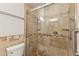 Bathroom featuring a tiled shower with glass doors and a towel rack at 11627 S Jokake St, Phoenix, AZ 85044