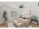 Comfortable bedroom featuring shutters on the window, a ceiling fan and contemporary decor at 11627 S Jokake St, Phoenix, AZ 85044