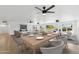 Spacious dining area featuring a modern table setting and open layout to the living room at 11627 S Jokake St, Phoenix, AZ 85044