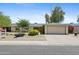 Charming single-story home featuring a well-maintained front yard with mature landscaping and a two-car garage at 11627 S Jokake St, Phoenix, AZ 85044