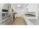 Modern kitchen with stainless steel appliances, granite countertops and tile flooring at 11627 S Jokake St, Phoenix, AZ 85044