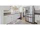 Bright kitchen with white cabinets, stainless steel appliances and granite countertops at 11627 S Jokake St, Phoenix, AZ 85044