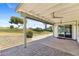 Covered patio overlooking landscaped grounds and a grassy knoll at 11627 S Jokake St, Phoenix, AZ 85044