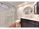 Modern bathroom featuring a glass shower, updated vanity, and stylish design elements at 14818 N 10Th St, Phoenix, AZ 85022