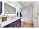 Clean bathroom with a modern vanity, bath tub and stylish design, offering both comfort and functionality at 14818 N 10Th St, Phoenix, AZ 85022