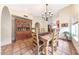 Chandelier illuminates the dining room with Saltillo tile and archway to the kitchen at 14818 N 10Th St, Phoenix, AZ 85022