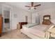 Well-lit bedroom featuring a neutral-toned color scheme and connected bathroom at 19875 W Badgett Ln, Litchfield Park, AZ 85340