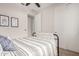 Cozy bedroom featuring a bed, a closet, and bright natural lighting at 19875 W Badgett Ln, Litchfield Park, AZ 85340