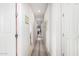 Hallway features clean lines, neutral walls, and tiled flooring, creating a cohesive transition between rooms at 19875 W Badgett Ln, Litchfield Park, AZ 85340