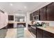 Modern kitchen with a center island, stainless steel appliances, and abundant cabinet space at 19875 W Badgett Ln, Litchfield Park, AZ 85340