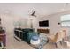 Comfortable living room with modern decor, a ceiling fan, and a large area rug at 19875 W Badgett Ln, Litchfield Park, AZ 85340