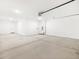 Spacious two car garage with utility sink and an automatic garage door opener, providing ample storage at 37111 W Parador Ln, Maricopa, AZ 85138