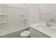 A clean bathroom features a shower-tub combo and a white vanity at 37151 W Parador Ln, Maricopa, AZ 85138