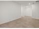 This bedroom features neutral tile flooring and a minimalist design at 37151 W Parador Ln, Maricopa, AZ 85138