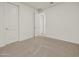 Spacious bedroom features plush carpeting and easy access to adjoining rooms at 37151 W Parador Ln, Maricopa, AZ 85138