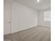 A well lit bedroom features neutral carpeting and a single window at 37151 W Parador Ln, Maricopa, AZ 85138