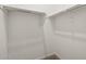 A walk-in closet features ample shelving for optimal storage at 37151 W Parador Ln, Maricopa, AZ 85138
