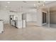Spacious kitchen with stainless steel appliances, a large island, and modern pendant lighting at 37151 W Parador Ln, Maricopa, AZ 85138