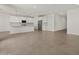 Spacious open-concept kitchen featuring modern stainless steel appliances and ample counter space at 37151 W Parador Ln, Maricopa, AZ 85138