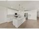 Bright kitchen featuring stainless steel appliances, a large island, and modern pendant lighting at 37151 W Parador Ln, Maricopa, AZ 85138