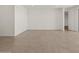 Bright and spacious living area with tile flooring and a minimalist design at 37151 W Parador Ln, Maricopa, AZ 85138
