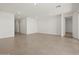 Open-concept living area boasting tile flooring, recessed lighting, and ample space at 37151 W Parador Ln, Maricopa, AZ 85138