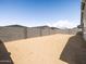 Wide shot of the backyard fenced with cinder blocks, providing a private space at 4032 S 176Th Dr, Goodyear, AZ 85338