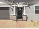 Welcoming front entrance featuring brick pillars, a secure metal gate, and a neatly paved walkway at 4032 S 176Th Dr, Goodyear, AZ 85338