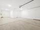 Well-lit garage interior with concrete floor, ideal for parking and workshop activities at 4032 S 176Th Dr, Goodyear, AZ 85338