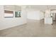 Open-concept living area with tile floors, recessed lighting, and seamless flow into the kitchen at 4032 S 176Th Dr, Goodyear, AZ 85338