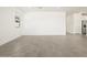 Bright living room featuring neutral paint, tile floors, and natural light from the window at 4032 S 176Th Dr, Goodyear, AZ 85338