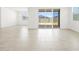 Bright living room featuring tile floors, recessed lighting, and seamless flow into the dining room at 4032 S 176Th Dr, Goodyear, AZ 85338