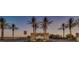 Elegant Tartesso community entrance with lush palm trees welcomes residents and guests at 4088 N 309Th Cir, Buckeye, AZ 85396