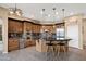 A gourmet kitchen features custom cabinetry, granite countertops, and stainless steel appliances at 5744 E Hedgehog Pl, Scottsdale, AZ 85266