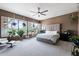 Bright, spacious main bedroom with large windows, stylish decor, and neutral color palette at 5744 E Hedgehog Pl, Scottsdale, AZ 85266