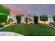 Secluded backyard featuring manicured lawn, mature trees, and serene desert landscaping at 11011 N 92Nd St # 1010, Scottsdale, AZ 85260
