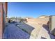 Large backyard with a gazebo, patio furniture, a barbecue grill, and a brick-paved patio at 14912 W Lamoille Dr, Surprise, AZ 85374