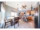 Cozy dining area adjacent to the kitchen with natural light and tile flooring at 14912 W Lamoille Dr, Surprise, AZ 85374