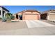Charming single-Gathering home showcasing a two-car garage, desert landscaping and a cozy front entry at 14912 W Lamoille Dr, Surprise, AZ 85374