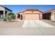 Charming single-Gathering home showcasing a two-car garage, desert landscaping and a cozy front entry at 14912 W Lamoille Dr, Surprise, AZ 85374