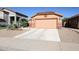 Charming single-Gathering home showcasing a two-car garage, desert landscaping and a cozy front entry at 14912 W Lamoille Dr, Surprise, AZ 85374