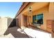 Inviting front porch with a metal security door and a cozy seating area for morning coffee at 14912 W Lamoille Dr, Surprise, AZ 85374