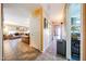 Spacious hallway leads to the living room with tile floors and neutral paint at 14912 W Lamoille Dr, Surprise, AZ 85374
