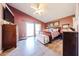 A cozy main bedroom with a sliding glass door, an ensuite, and neutral decor at 14912 W Lamoille Dr, Surprise, AZ 85374